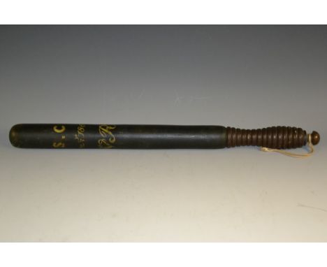 A Victorian tipstaff or truncheon, the ebonised shaft inscribed with the VR cypher in yellow, surmounted by the monogram S.C.