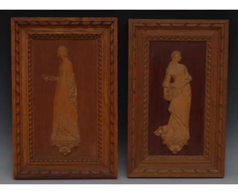 A pair of 19th century boxwood portrait plaques, carved and titled, Lady of the Flowers and Florence Nightingale, 24cm high, 