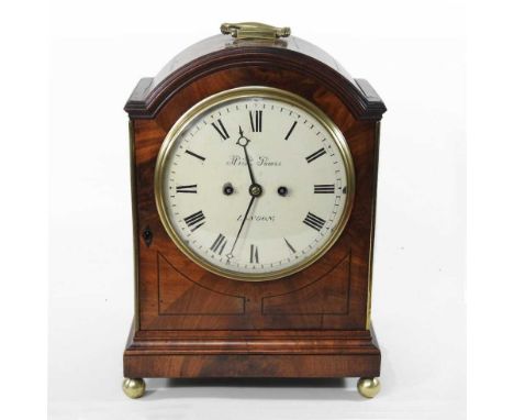 A 19th century mahogany cased bracket clock, having a white enamel dial, signed Rich Powis, London, the arched case surmounte