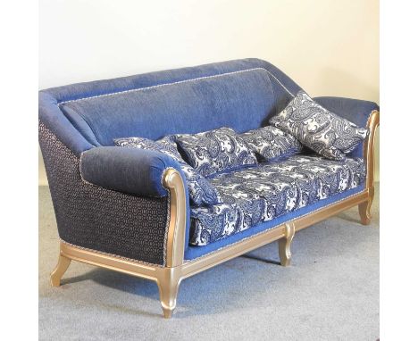 A gilt framed and blue upholstered sofa, with loose cushions222w x 82d x 96h cmCondition report: These were purchased in Duba