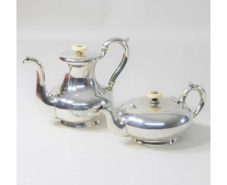 An early 20th century Russian silver teapot, of compressed oval shape, the hinged lid, with an ivory finial, 12cm diameter, t