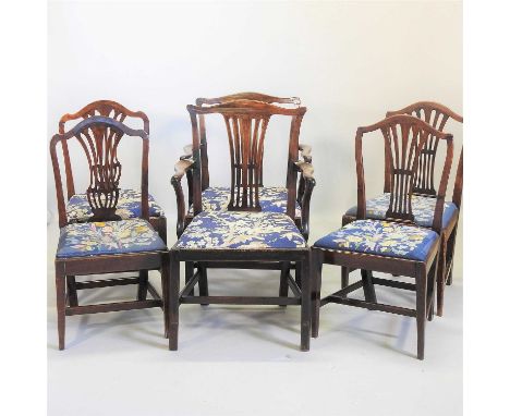 A near set of six George III mahogany dining chairs, each having a pierced vase shaped splat and tapestry seat, on square leg