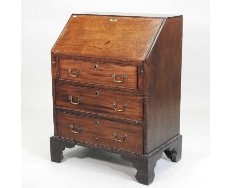 A George III mahogany bureau, of small proportions, with a hinged sloping fall, over three long drawers, on bracket feet69w x