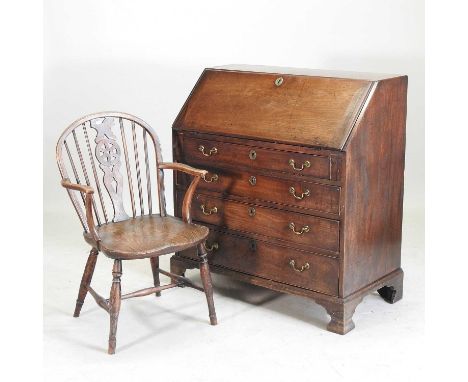 A George III mahogany bureau, with a hinged fall over four long drawers on bracket feet, together with a 19th century elm sea