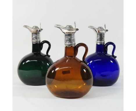 A 19th century coloured glass claret jug, with a silver plated top, together with two others (3)21cm highCondition report: Ov