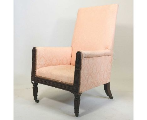 A Regency mahogany library chair, upholstered in pink fabric, on turned and fluted legs, terminating in brass castors68w x 68