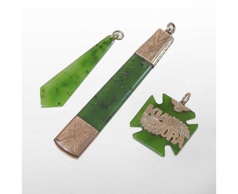 A jade coloured hardstone pendant, with engraved gilt mounts, 8cm long, together with another inscribed KIAORA and another sm