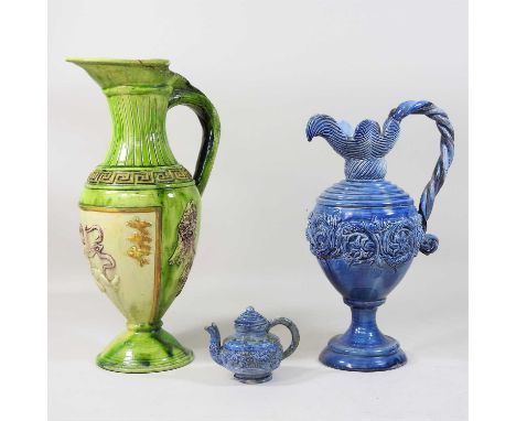 A 19th century Castle Hedingham pottery green glazed ewer, decorated in relief with Greek motifs, inscribed E Bingham no 6 wi