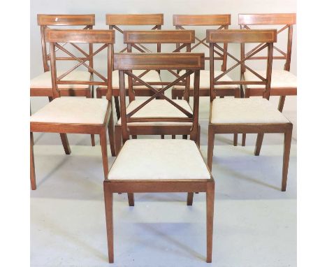 A set of eight Edwardian style mahogany and inlaid dining chairs, 20th century, each with a bar back and cream padded seat, o