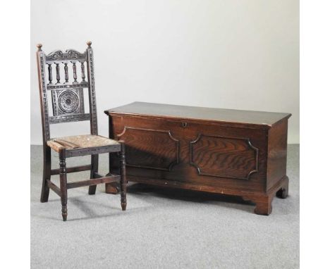 A 19th century elm coffer, with a hinged lid, on bracket feet, together with an 18th century style carved dark oak chair, wit