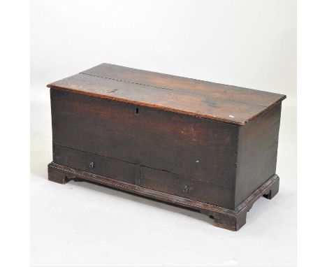 An 18th century oak mule chest, with a hinged lid, containing a pair of short drawers below, on bracket feet100w x 47d x 48h 