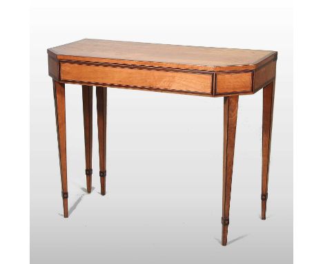 A George III satinwood folding card table, of canted rectangular shape, with boxwood and rosewood inlay, on square tapered le