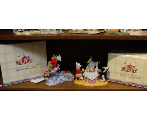 Two Royal Doulton ceramic figure groups, "Rupert and the King" and "Rupert rides Home", both in original boxes, both with lim