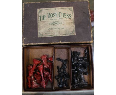 A vintage chess set "The Rose" lead chess pieces in original box