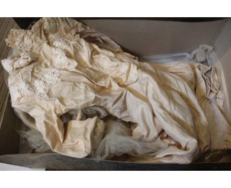 A vintage Harrods wedding dress together with veil, in original Harrods box
