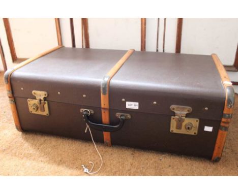 A wooden banded Steamer Trunk with key