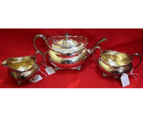 Atkin Brothers, a silver three piece tea set of Georgian design, comprising tea pot, milk jug and sugar bowl, Sheffield 1930,