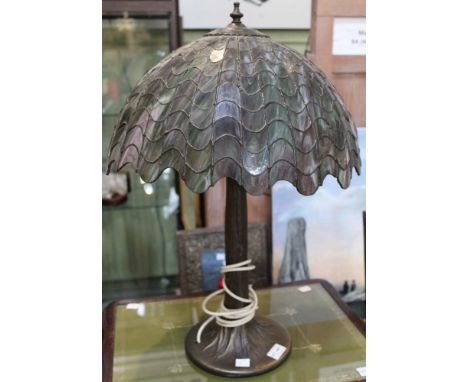 A modern metal based lamp with Tiffany style shade in the form of a tree trunk