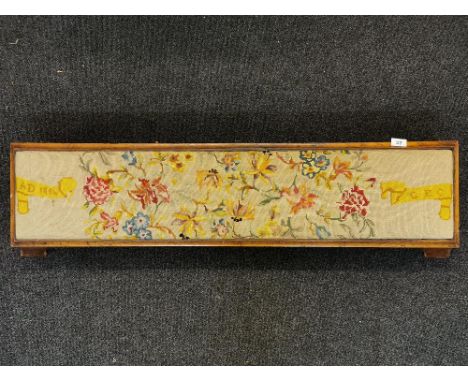 A walnut veneered tapestry upholstered double prayer stool, 119 x 29cm.