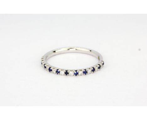 A 9ct white gold sapphire and diamond set half eternity ring, (L).