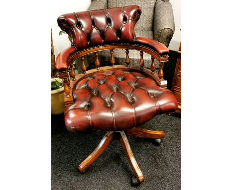 A leather button upholstered mahogany swivel captains chairs (A/F).