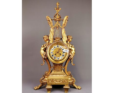 A large early 20th century French gilt brass mantel clock, H. 71cm.