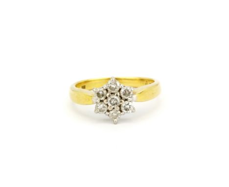 An 18ct yellow gold diamond set cluster ring, (L).