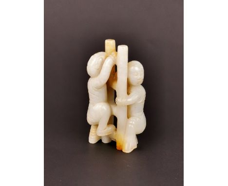 A 19th / early 20th Century Chinese carved white and russet jade figure of two boys climbing a ladder, H. 8cm.