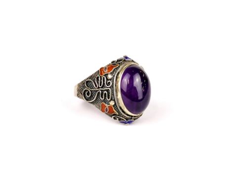 A Chinese enamelled silver and cabochon amethyst ring, adjustable size.