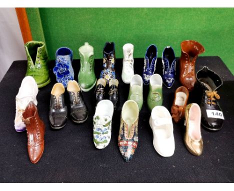 A group of Victorian and other ceramic shoes.