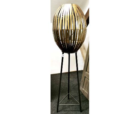 A contemporary gilt metal black tubular standard lamp, Hm 139cm.