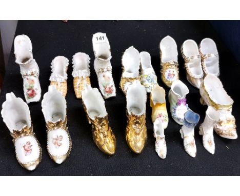 A group of mixed Victorian and Edwardian ceramic shoes.