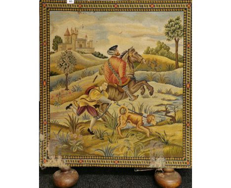 A 19th Century tapestry fire screen with turned oak feet, 84 x 100cm.