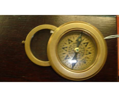 Metal compass with magnifying glass