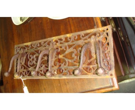 Cast iron triple coat hanger