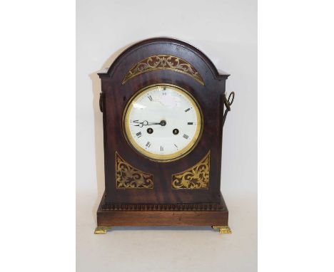 Late 19th century mahogany cased mantel or bracket clock, the arched case with pierced brass decoration to a white enamelled 