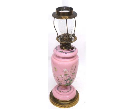 Large Victorian oil lamp, the ceramic body decorated with foliage and butterflies with glass chimney above, on circular base