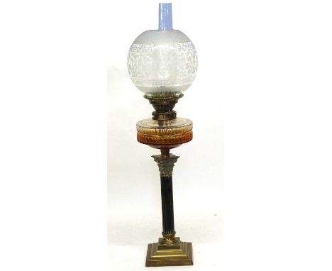 Late 19th century oil lamp with Corinthian column and amber glass reservoir with white engraved shade