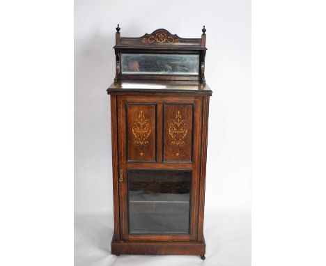 Late 19th/early 20th century rosewood music cabinet with mirrored back over a body with a part-glazed door opening to a shelv