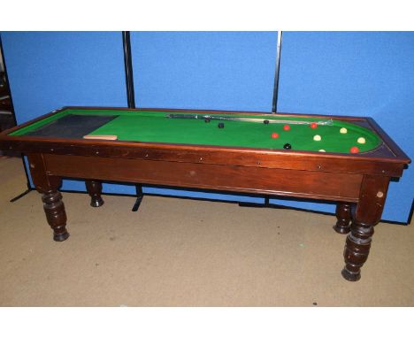 J Ashcroft &amp; Co, Victoria St, Liverpool, a good quality bagatelle table raised on heavy turned legs together with accompa