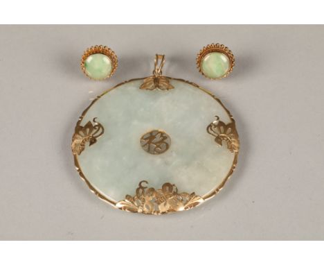 Ladies 14k gold mounted jade pendant, with a pair of 9 carat gold matching earrings.
