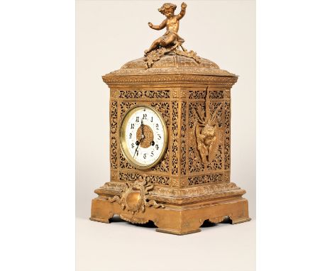 19th century French gilt metal mantle clock, pierced scroll work case, with applied cherub finial, circular enamelled dial, 8