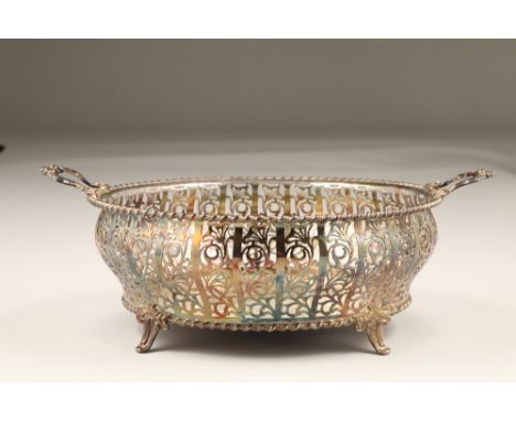 Silver pierced bread basket, with twin handles, assay marked London 1927 by R Stewart, Glasgow, weight 715g.CONDITION REPORT;