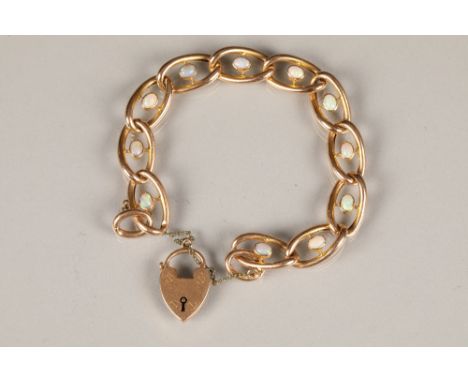 Ladies 15 carat gold bracelet, with set oval opal cabochons, 9 carat gold heart shaped clasp, 15g. CONDITION REPORT:This is c