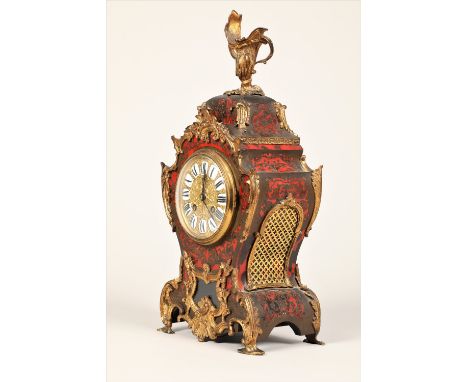 19th century French boulle work mantle clock, with gilt metal mounts.  Gilt dial with ceramic hour markers with roman numeral