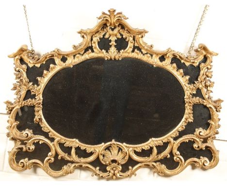 Late 19th/20th century rococo style giltwood mirror, 132cm long, 103cm high, 80cm wide.CONDITION REPORT:The giltwood mirror i