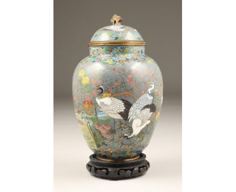 Japanese cloisonne jar and cover, decorated with storks and prunus trees, on grey ground (damaged), 30cm high.CONDITION REPOR