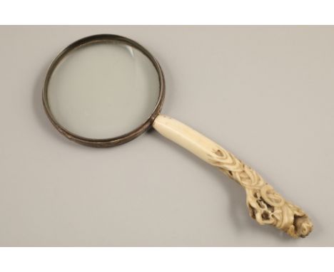 19th century carved ivory handled magnifying glass, snake in foliage, with a toad finial, handle measures, 16cm long.Conditio