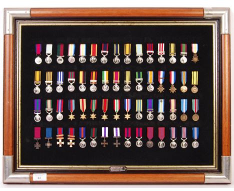 A good British Campaign &amp; Gallantry miniature medals display. Comprising of: x60 assorted miniature medals - including Bo