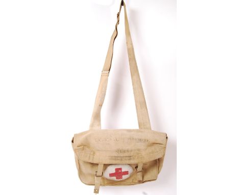 A WWII Second World War British Army canvas khaki medics bag shoulder satchel having a red cross on a white ground to front, 